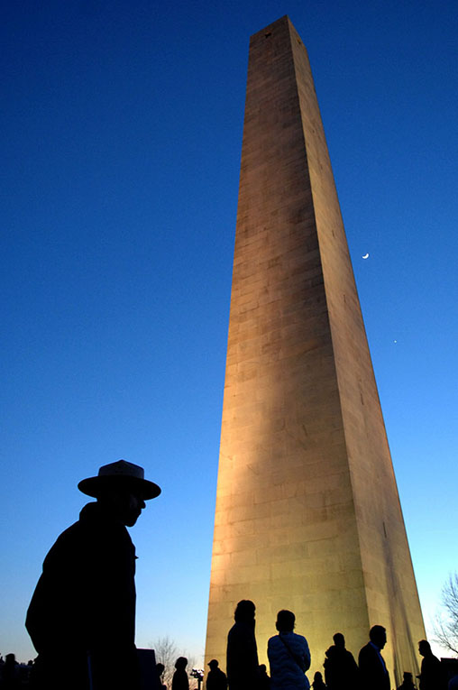silhouette of park ranger at bunker hill monument